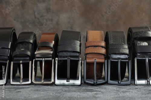 Genuine and Faux leather belts concept, Brown and black leather for denim, linen or corduroy trousers, stylish belt