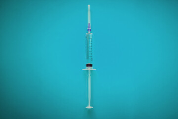 Wall Mural - syringe. syringe on blue background