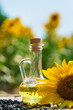 Sunflower oil in a bottle on the field. Selective focus.