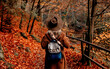 Young woman in hat in an autumn season park