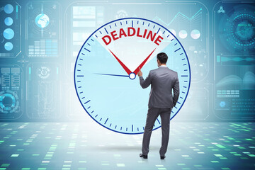 Businessman in deadline and time management concept