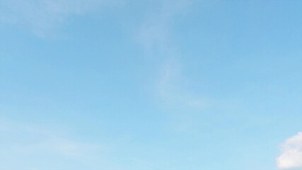 sunny clear blue sky background with airy white clouds