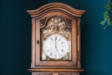 Fototapeta Tęcza - an antique clock on a background