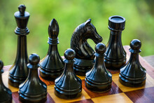 Black Chess Pieces On A Chessboard. Game Of Chess