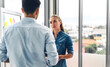 © Art_Photo - Two professional business man and woman meeting and discussing strategy with new startup project.Creative business people planning and brainstorm in modern office.Teamwork