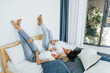 © standret - Laying down on the bed. Two women is together at home
