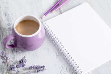 Cup coffee, coffee with milk and notepad on wooden gray table.