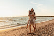 © Syda Productions - leisure and people concept - happy couple having fun on summer beach