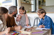 © Halfpoint - Father with three daughters indoors at home, drawing pictures.