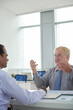 © DragonImages - Emotional mature entrepreneur actively gesturing when explains his ideas to colleague at meeting