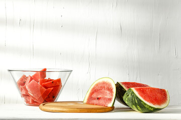 Poster - Wooden desk with pedestal for your decoration and fresh watermelon 