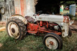 © Ursula Page - a vintage old antique res and gray tractor at a rural farm