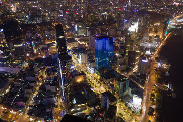 Wall Mural - Aerial panoramic cityscape view of HoChiMinh City and Bitexco tower , Vietnam with blue sky at night .