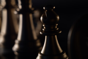 Poster - Closeup shot of chess pieces on dark background