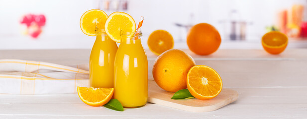 Wall Mural - Orange juice drink in bottle on wooden board panorama copyspace copy space