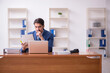© Elnur - Young businessman employee working in the office