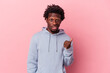 © Asier - Young african american man isolated on pink background shocked pointing with index fingers to a copy space.