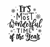 Fototapeta Most - It's the most wonderful time of the year Christmas greeting card. Inspirational winter quote with snowflakes and lettering. Holiday design for invitation cards, brochures, poster, t-shirts, mugs.