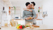 © tirachard - Asia gay couple using tablet and preparing the breakfast, sandwich vegetable on table in kitchen at home. Young LGBT men talking happy relax rest together spend romantic time at house in morning.