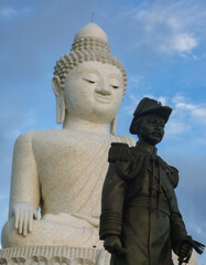 Sticker - Vertical shot of The Big Buddha under a blue sky and sunlight in Karon, Thailand