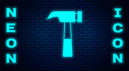 Sticker - Glowing neon Hammer icon isolated on brick wall background. Tool for repair. Vector