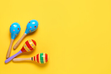 Mexican maracas on color background