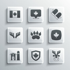 Sticker - Set Canada flag on shield, Deer head with antlers, Canadian maple leaf, Bear paw footprint, Farm house, Flag of and Christmas mitten icon. Vector