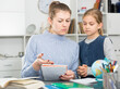 © JackF - Mother checks school assignments little daughter. High quality photo