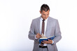 © blanke1973 - a young handsome businessman in a suit with a notebook