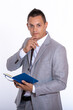 © blanke1973 - a young handsome businessman in a suit with a notebook