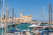 View of a nice fishing harbor and marina in Trani, with San Nicola Pellegrino Cathedral of Trani, Puglia region, Italy