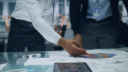Poster - Close Up of Two Automotive Engineers Working in Office at Car Factory. Industrial Designer Shows Conceptual Electric Engine Parts to Colleague, Discussing Work in Technological Laboratory.