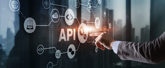 Application Programming Interface. API software development tool. Information technology concept. Businessman presses API text icon on a virtual interface