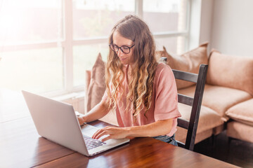 Poster - Cheerful woman using silver laptop