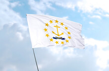 Flag Of Rhode Island In Front Of Blue Sky, Realistic 3D Rendering