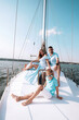 © Mykhailovskyi - happy family mom dad son sailing on a yacht on a joint weekend. sea vacation.