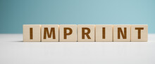 "Imprint" Web Banner - The Word Imprint Built From Letters On Wooden Cubes For The Use As A Web Banner.