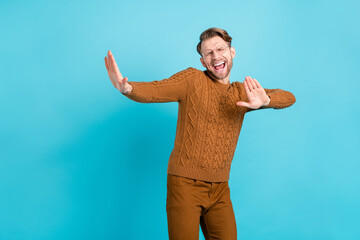 Sticker - Photo of cheerful happy funky young man dance wear glasses good mood isolated on pastel blue color background