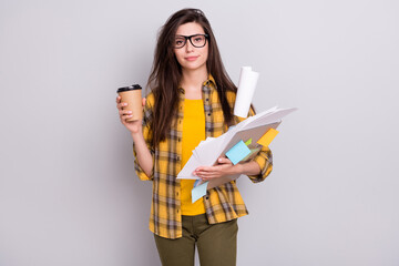 Poster - Photo of young woman unhappy upset overworked paper documents drink coffee isolated over grey color background