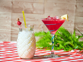 Canvas Print - Selective focus shot of a raspberry cocktail and a pina colada