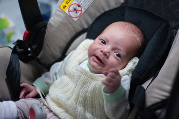 Canvas Print - Closeup shot of a newborn baby in a stroller