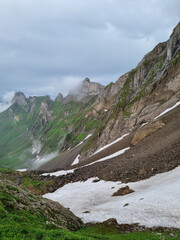 Poster - Closeup view of some of the parts of the mountain covered in snow on a gloomy day