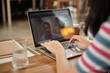 © tigercat_lpg - Freelance casual Asian woman typing on laptop for online meeting, e-commerce chat, business communications, and internet learning while working from home. Quarantine due to COVID-19 lifestyle.