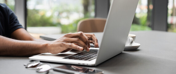 Male hands typing on computer keyboard closeup panoramic banner, business man or student using laptop at home, online learning, internet marketing, people working office workplace, freelance concept