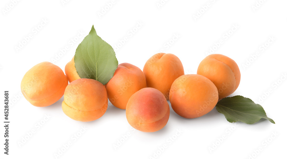 Tasty ripe apricots on white background