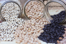 Jars Of Black-eyed Peas, Chick Peas, Black Beans And Pinto Beans Spilled In Kitchen