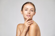 © Anatoly Repin - Beautiful Young Woman with Clean Fresh Skin standing over light grey background