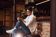 © standret - Having a rest. Man in casual clothes sitting in the pub