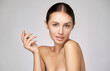 © Anatoly Repin - Beautiful Young Woman with Clean Fresh Skin standing over light grey background