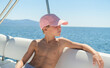 © 22Imagesstudio - 10 years boy traveling on motor yacht. Rest on a yacht